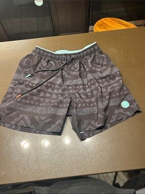 ZYIA Black Patterned Swim Trunks with Teal Accents
